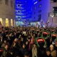 Crowd holds placards in protest outside the BBC